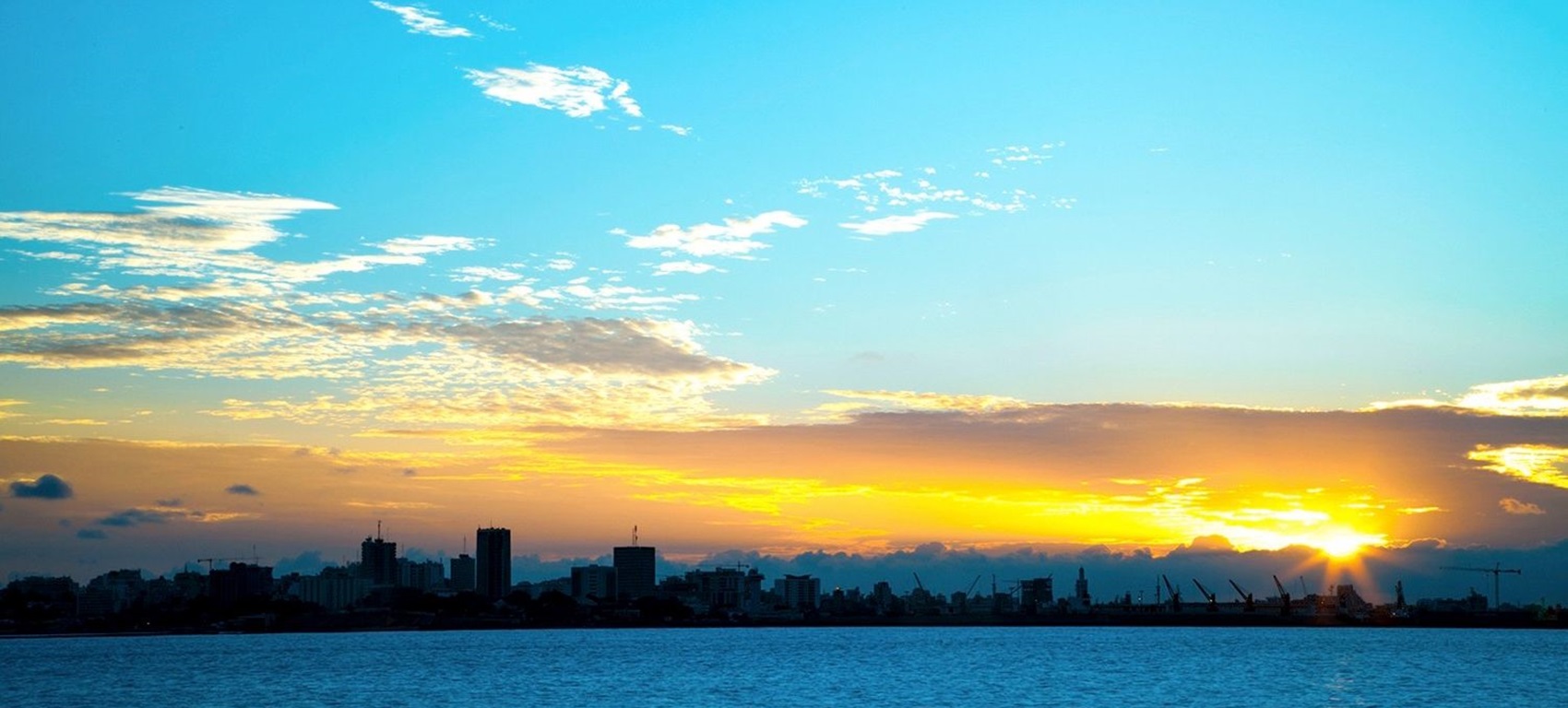 View of the Woodside Sangomar Field Development across the water at sunset